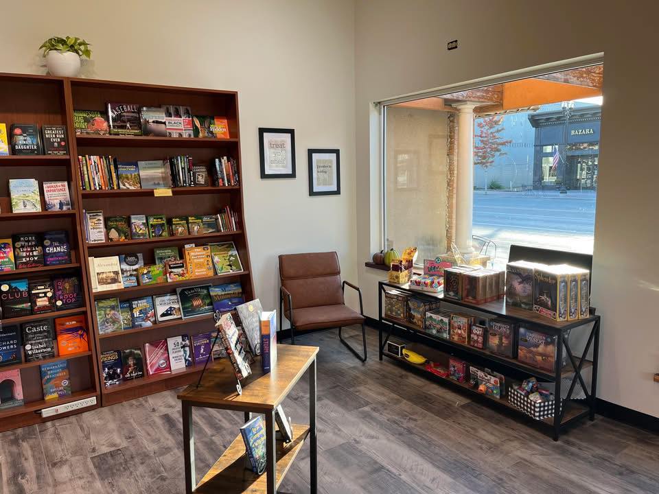 Children’s books and a reading chair by the front window at Cherry Street Books